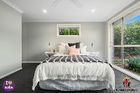 main bedroom 1 with logos