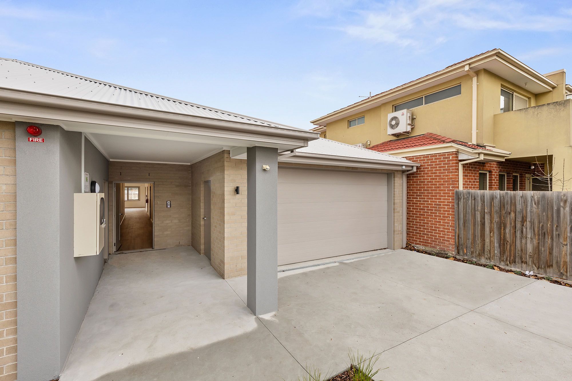 Freda Unit 2 Entrance and Garage 1 LR No Logo