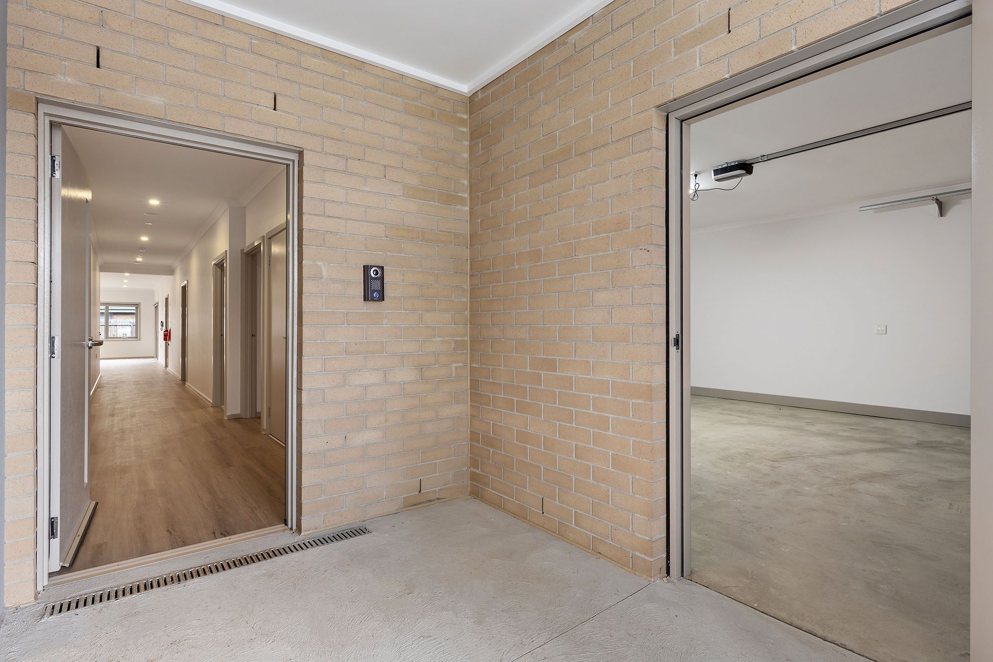 Freda Unit 2 Entrance and Garage 3 LR No Logo
