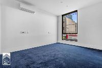 bedroom with blue carpet