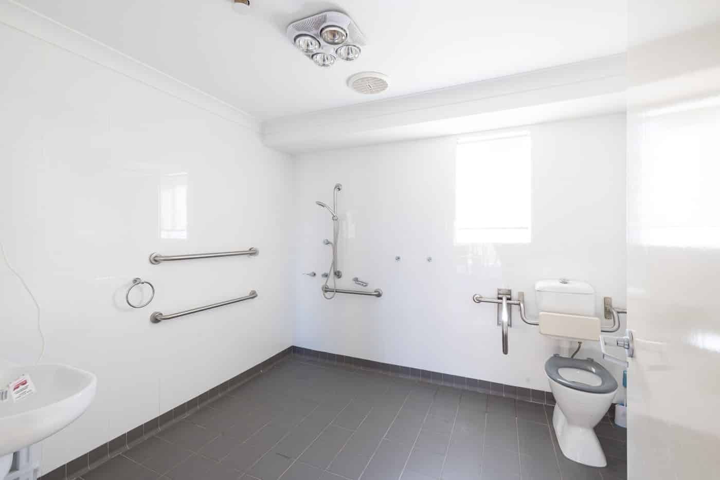 Large accessible-bathroom-with-shower-and-toilet