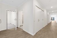 Rowans   Hallway into Garage and OOA Bathroom LR No Logo