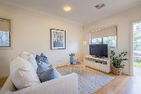 Modern living-room-with-couch-and-TV-for-entertainment